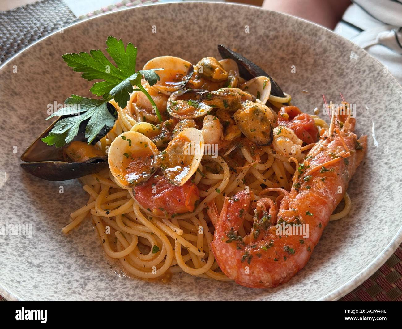 A dish of seafood pasta-  prawns, mussels, scallops - Smartphone Captured Stock Image