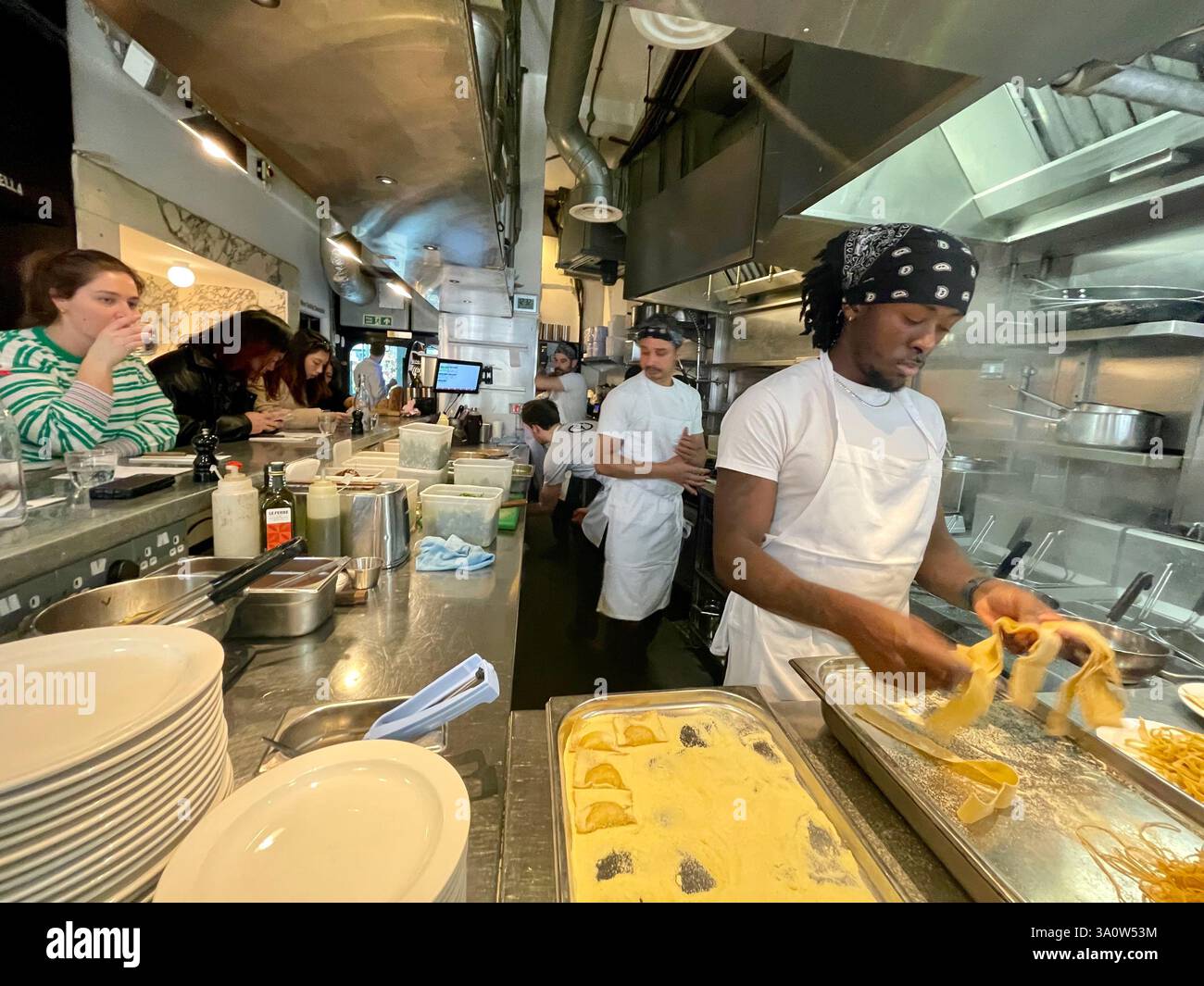 the kitchen of padella borough Italian restaurant with staff cooking ...