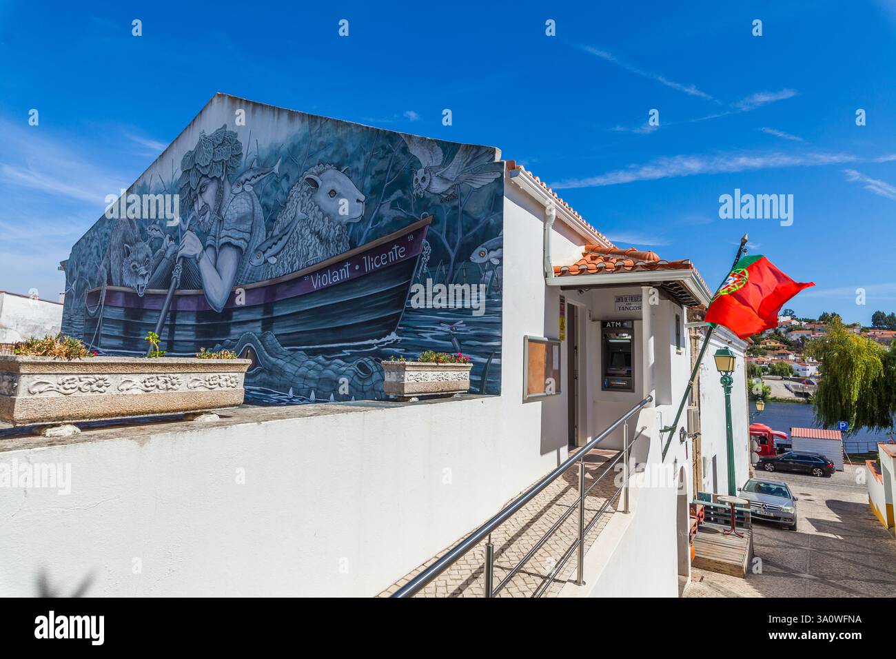 A large, detailed mural depicting a man rowing a boat with a wolf ...