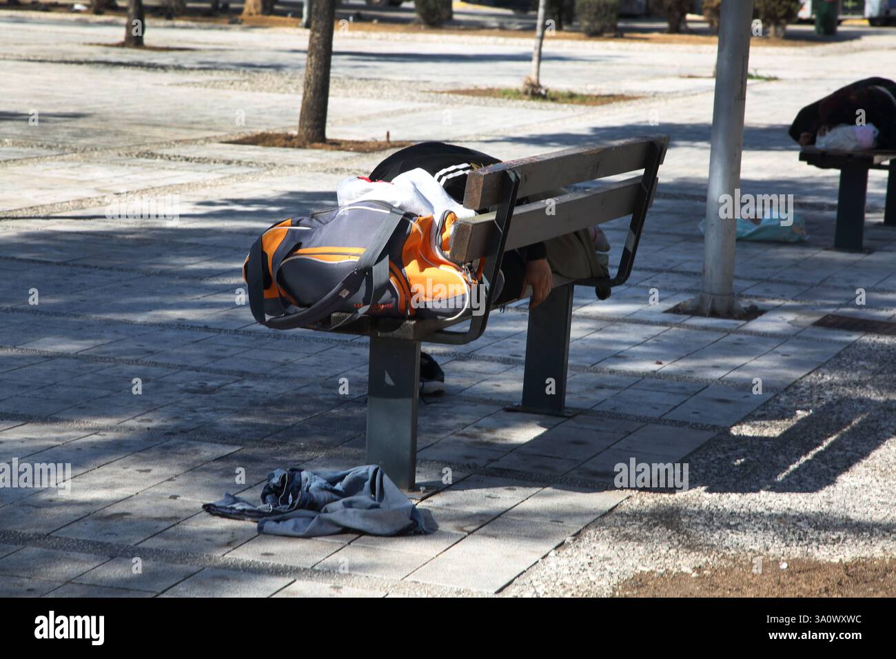 Greese Homless Homeless man Sleeping on Park Bench during the Day Glyfada Athens ...