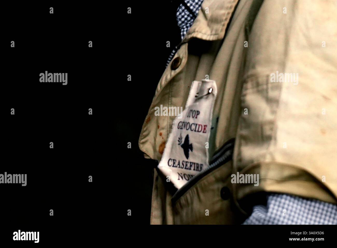 Genocide Patch Takamatsu Gushiken wears a patch that reads