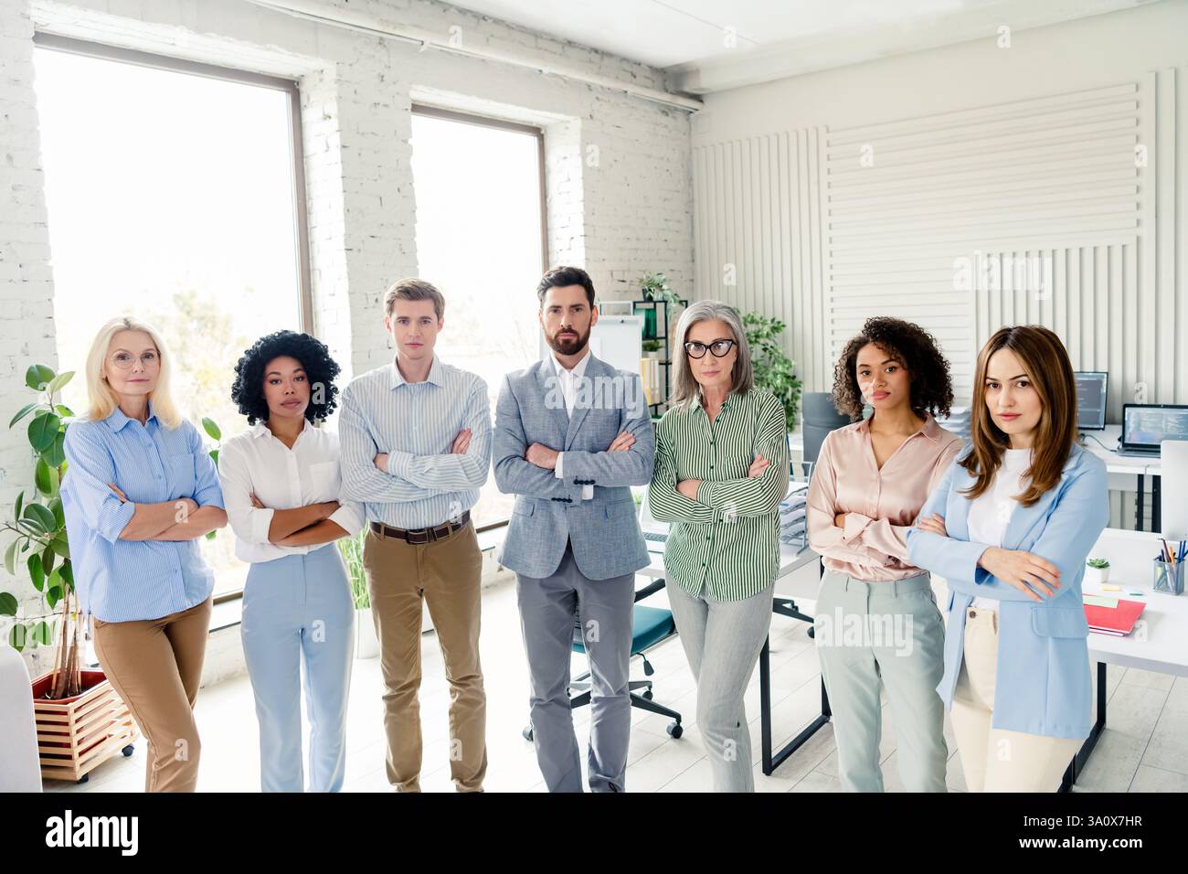 Group of diverse professionals standing confidently in an office ...