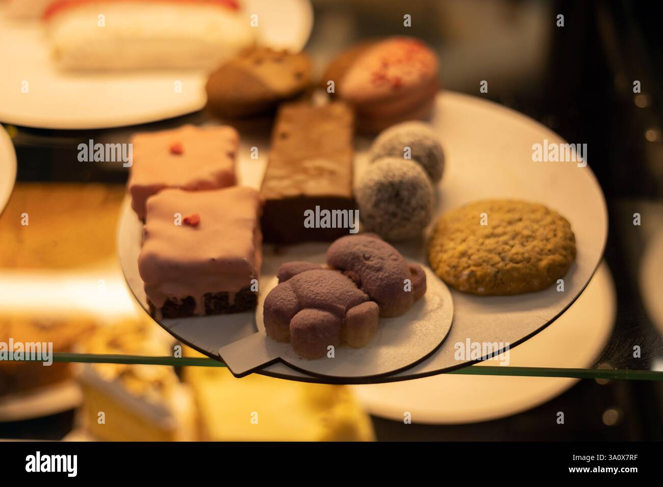 Various cakes on display in a store Stock Photo