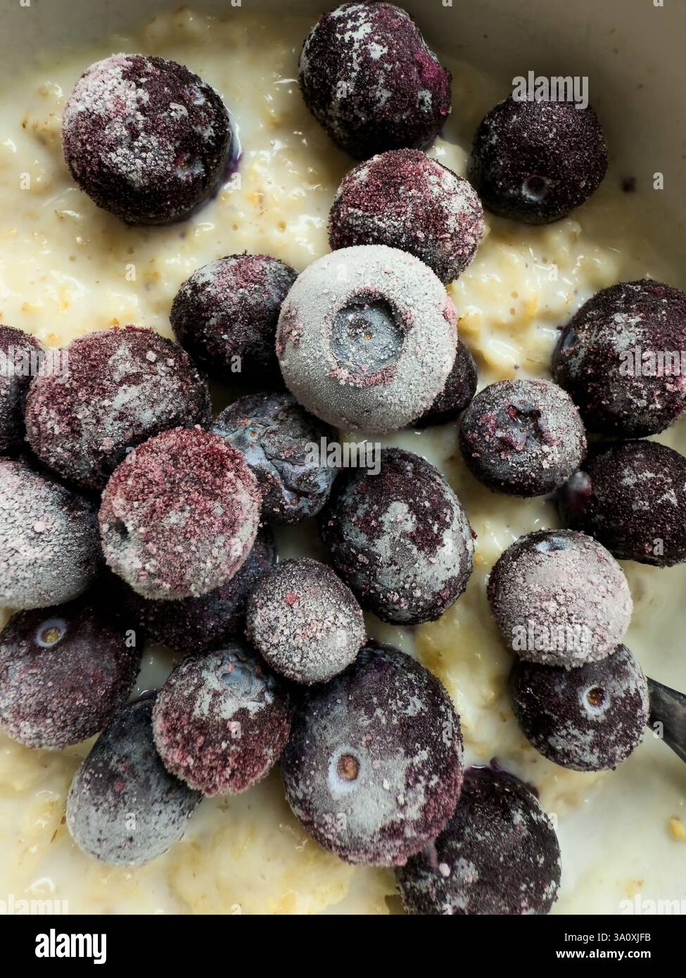 Oatmeal porridge with frozen blueberries - Smartphone Captured Stock Image
