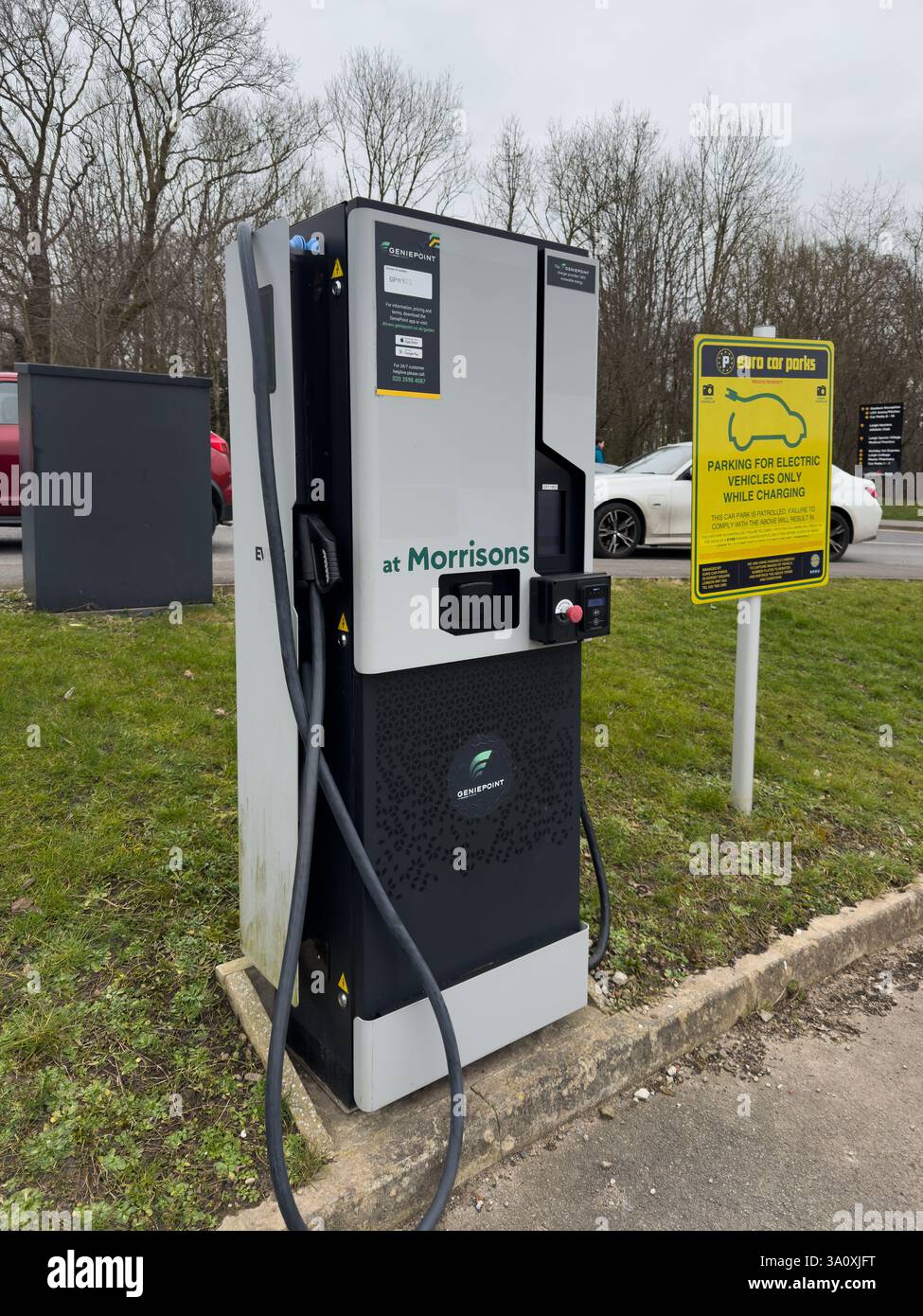 An electric car charger in a public car park - Smartphone Captured Stock Image