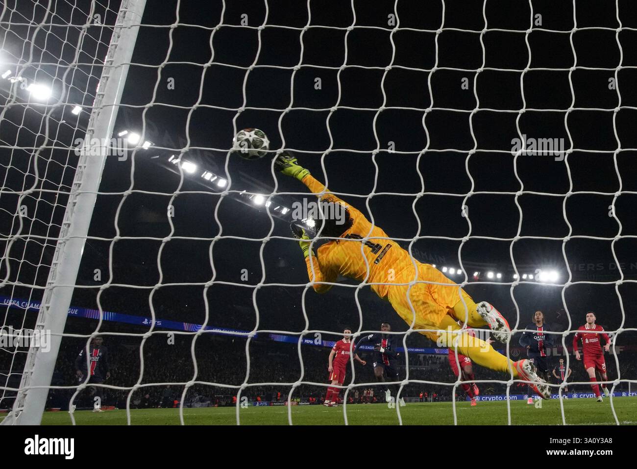 Liverpool's goalkeeper Alisson Becker makes a save during the Champions ...