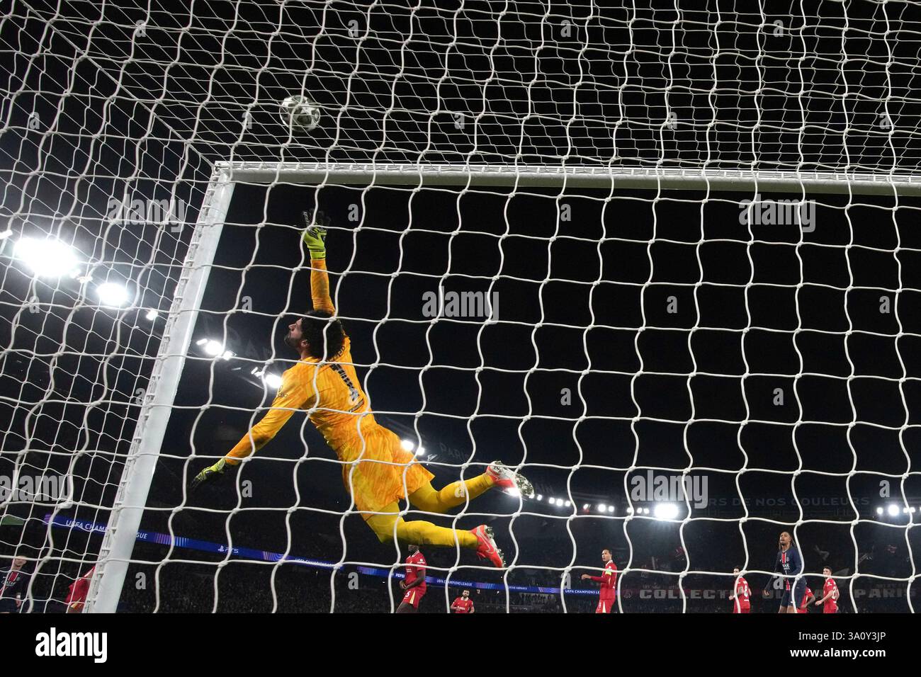 Liverpool's goalkeeper Alisson Becker makes a save during the Champions ...