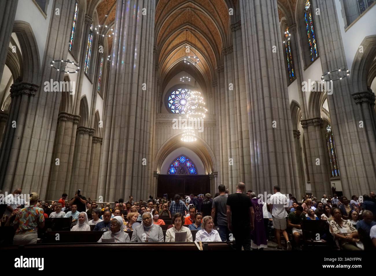 Catholic faithful attending a mass at Catedral Metropolitana Sé to ...