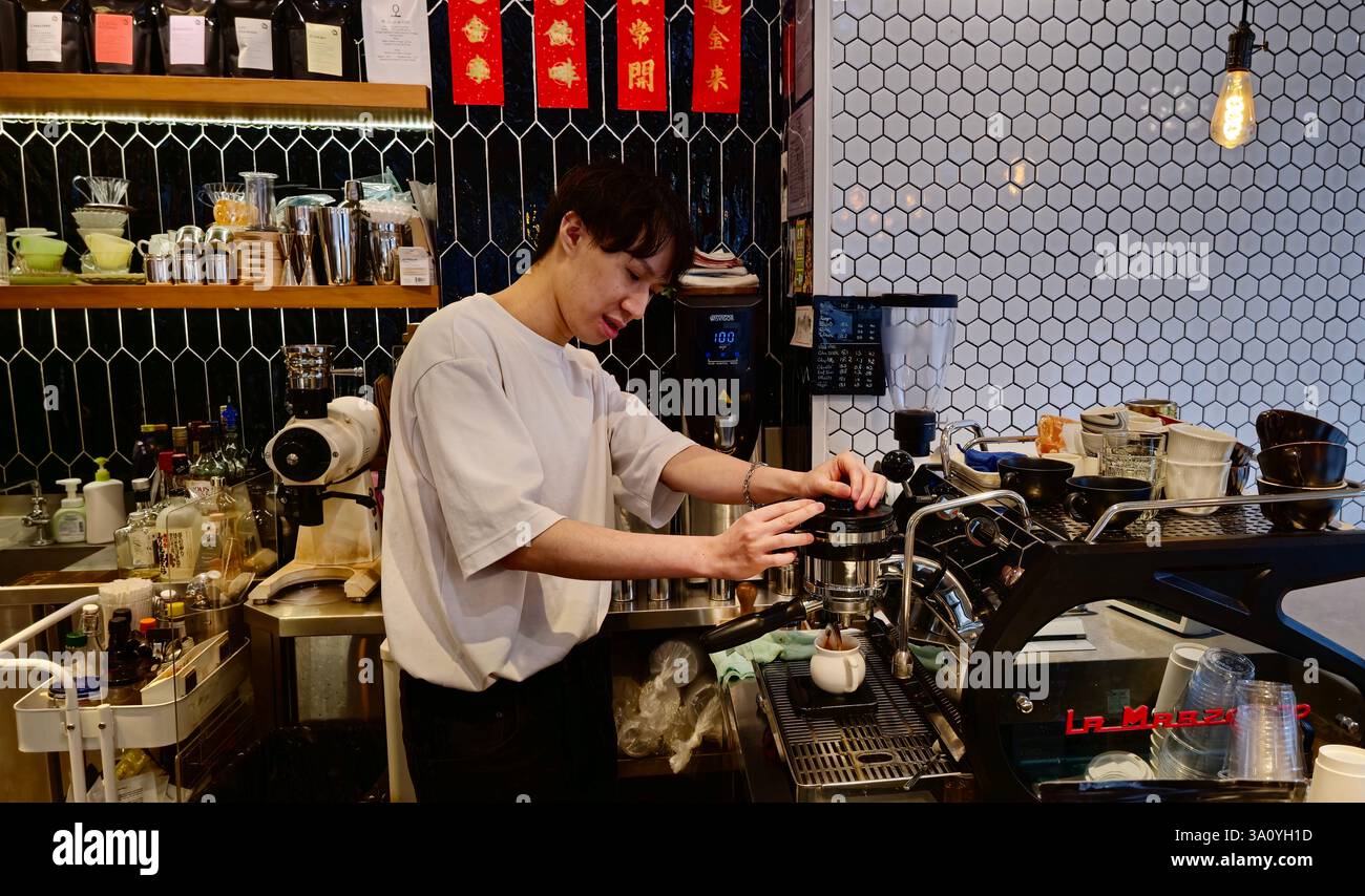 A barista preparing gourmet coffee at the Flow coffee shop in Sham Shui Po, Kowloon, Hong Kong. - Smartphone Captured Stock Image
