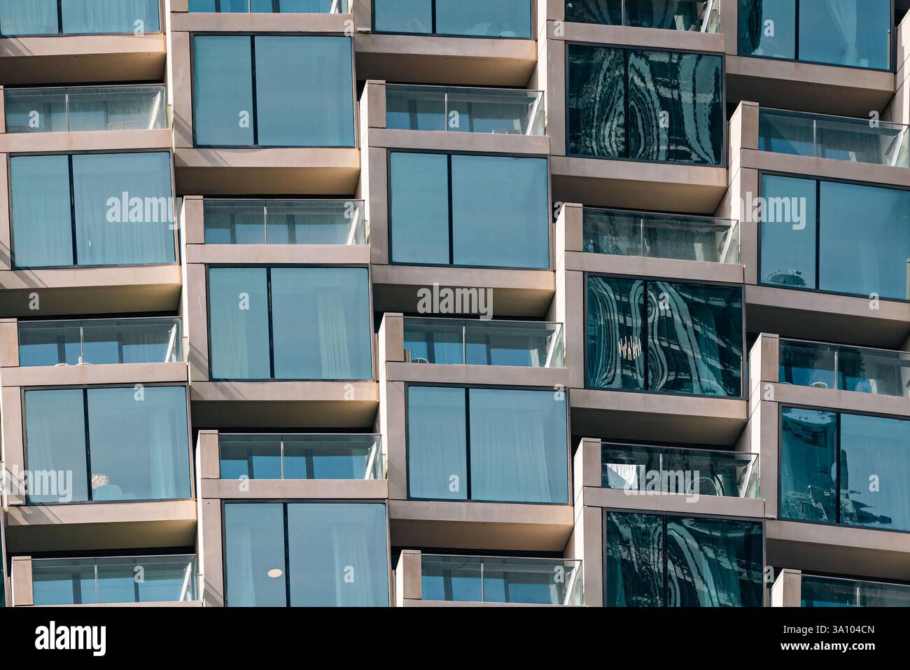 fragment of apartment building with similar floor to ceiling windows ...