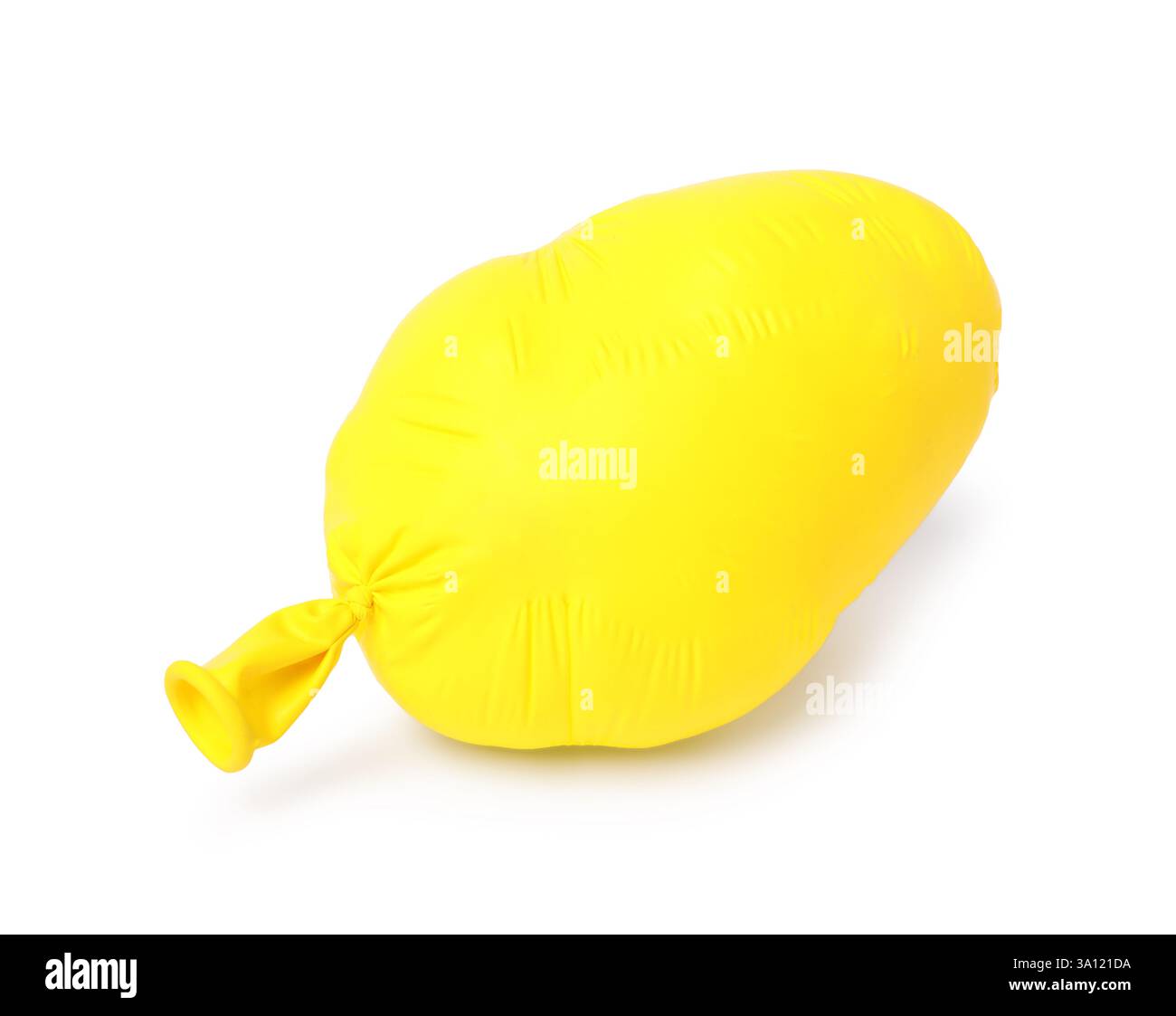One yellow half deflated balloon isolated on white Stock Photo - Alamy