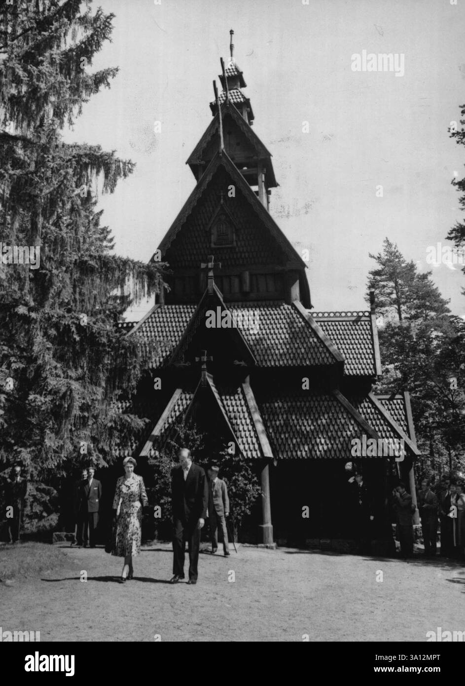 Royal Visit To Norway -- On the 24th June Queen Elizabeth II and the Duke of Edinburgh arrived in Oslo on a 3-day state via it to Norway , This is the Queen a first visit to any country outside the British Commonwealth. The second day of the visit included a garden party at the British Embassy and a Royal Galla Performance at the National Theatre in the evening. In the afternoon the Royal Guests visited the Norwegian Folk Museum the Viking Ships and the Kontiki House.High-light of the Royal sight-seeing on Saturday was the Queen's visit at the Gol Stave Church, a unique 12th century wooden str Stock Photo