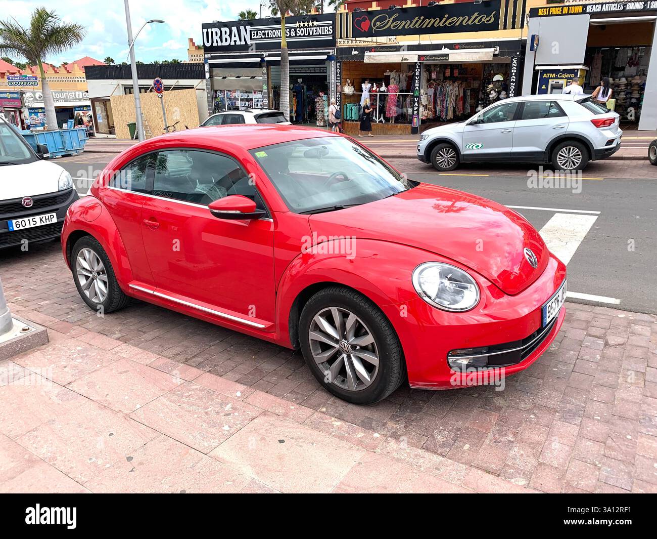 Red VW Golf Volkswagen German car sleeky sporty look looking parked Spain Spanish Canary Islands  shinny new style type saloon vehicle outside views - Smartphone Captured Stock Image