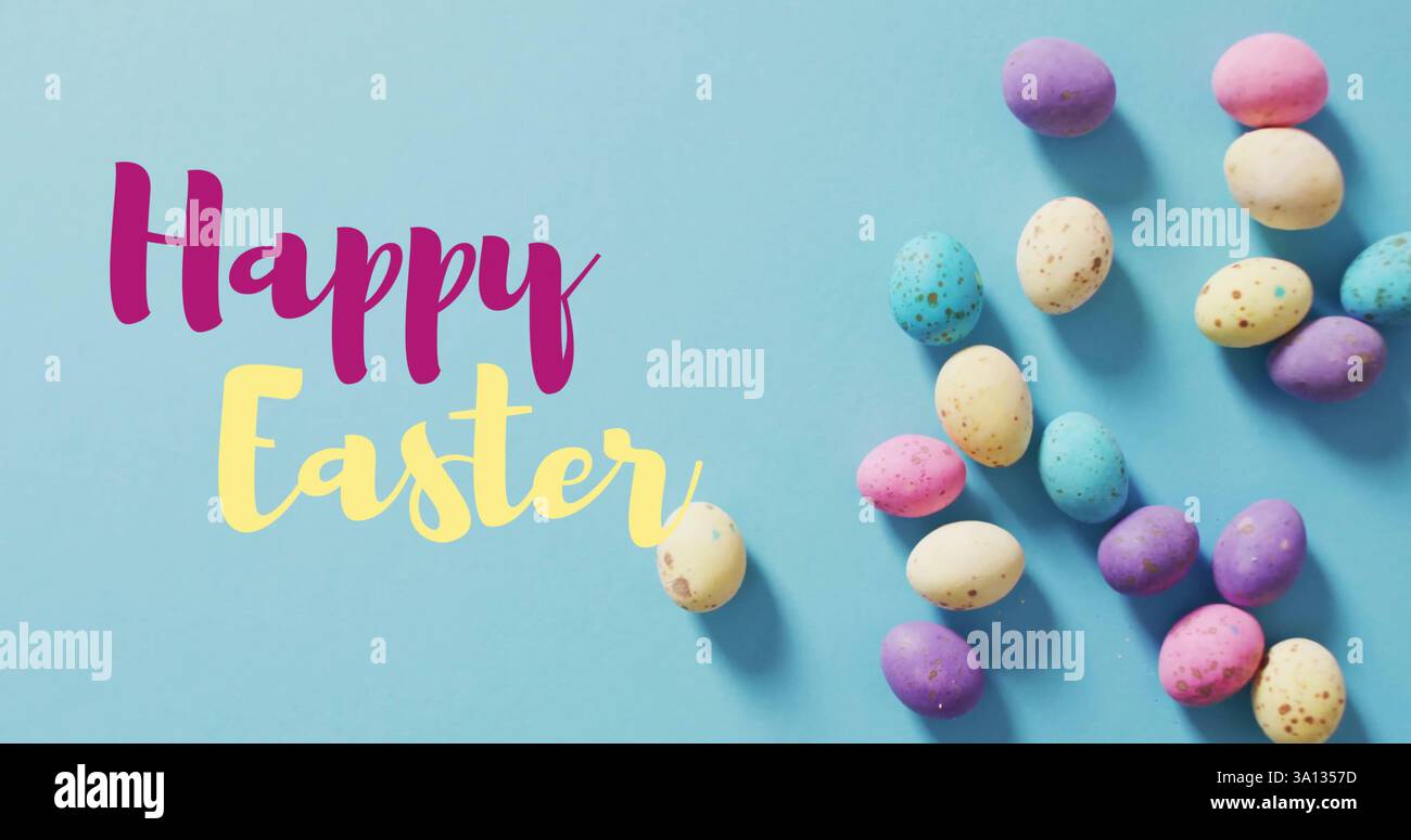 Image of happy easter text over easter eggs Stock Photo