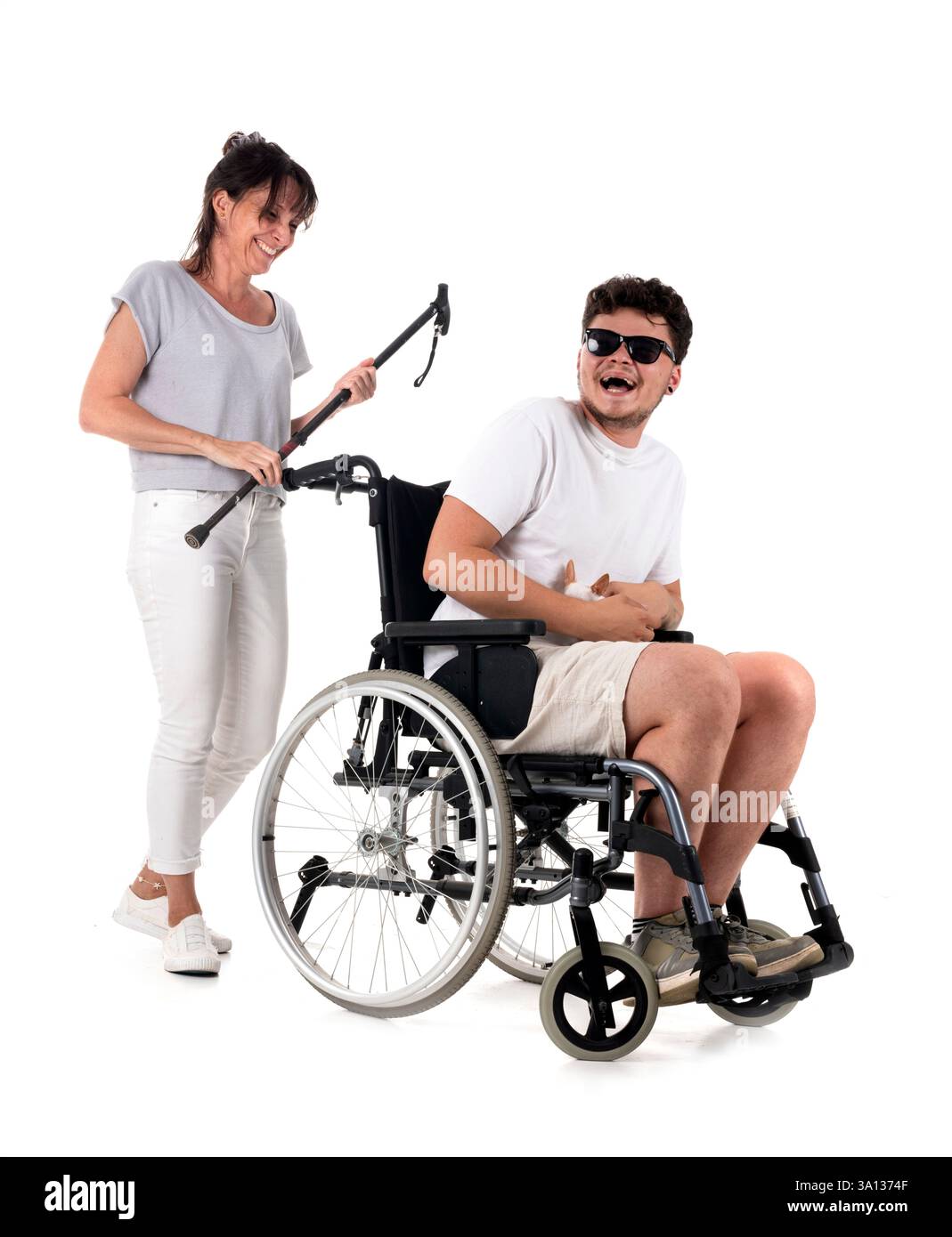 black wheelchair in front of white background Stock Photo