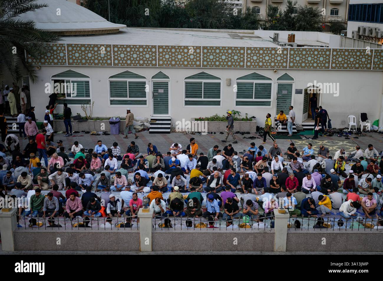 Muslims wait for the exact time to break their fast during the Muslim's ...
