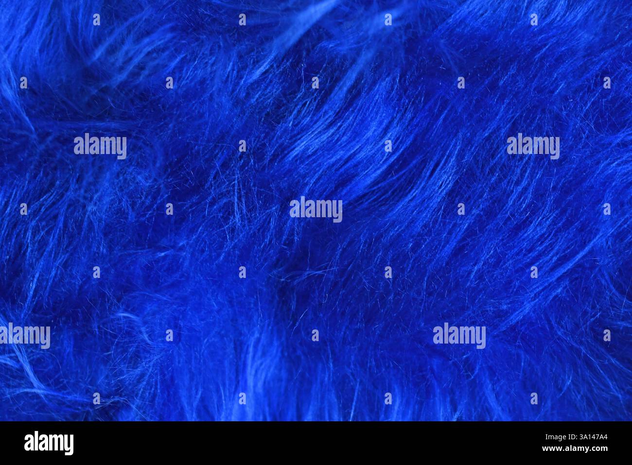 Close up of bright blue tousled synthetic fake fur Stock Photo