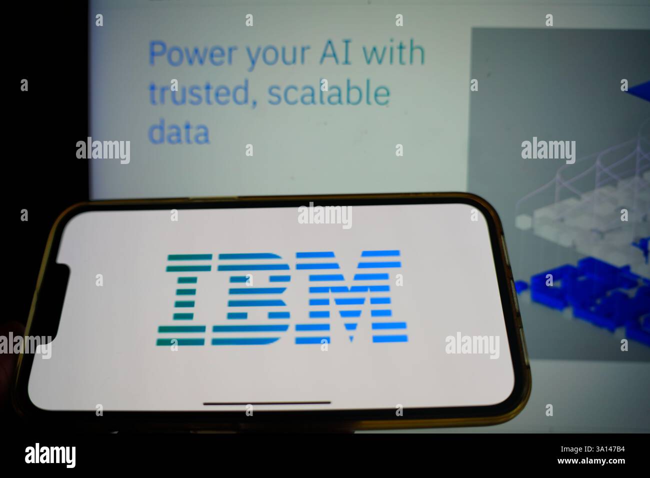 Roosendaal, The Netherlands - March 6, 2025: A mobile phone displaying the logo of IBM, with the company website in the background. Stock Photo