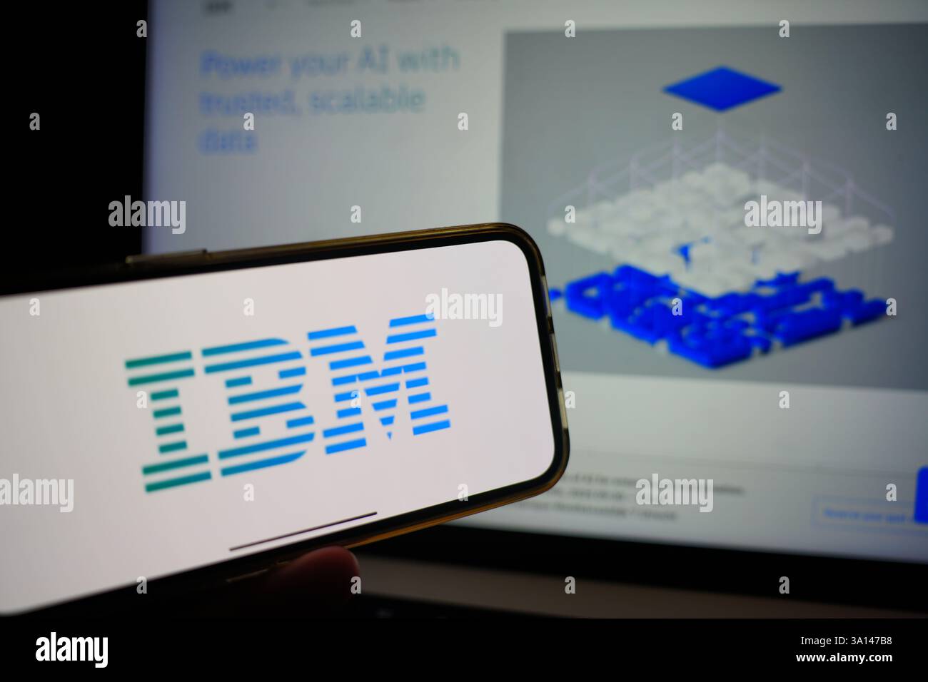 Roosendaal, The Netherlands - March 6, 2025: A mobile phone displaying the logo of IBM, with the company website in the background. Stock Photo