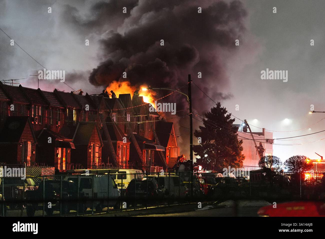 FILE - First responders work at the scene after a small plane crashed ...