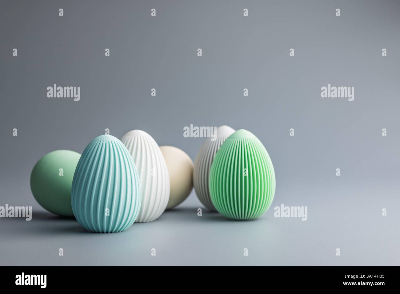 Easter decoration. Colorful eggs on a grey background. Stock Photo