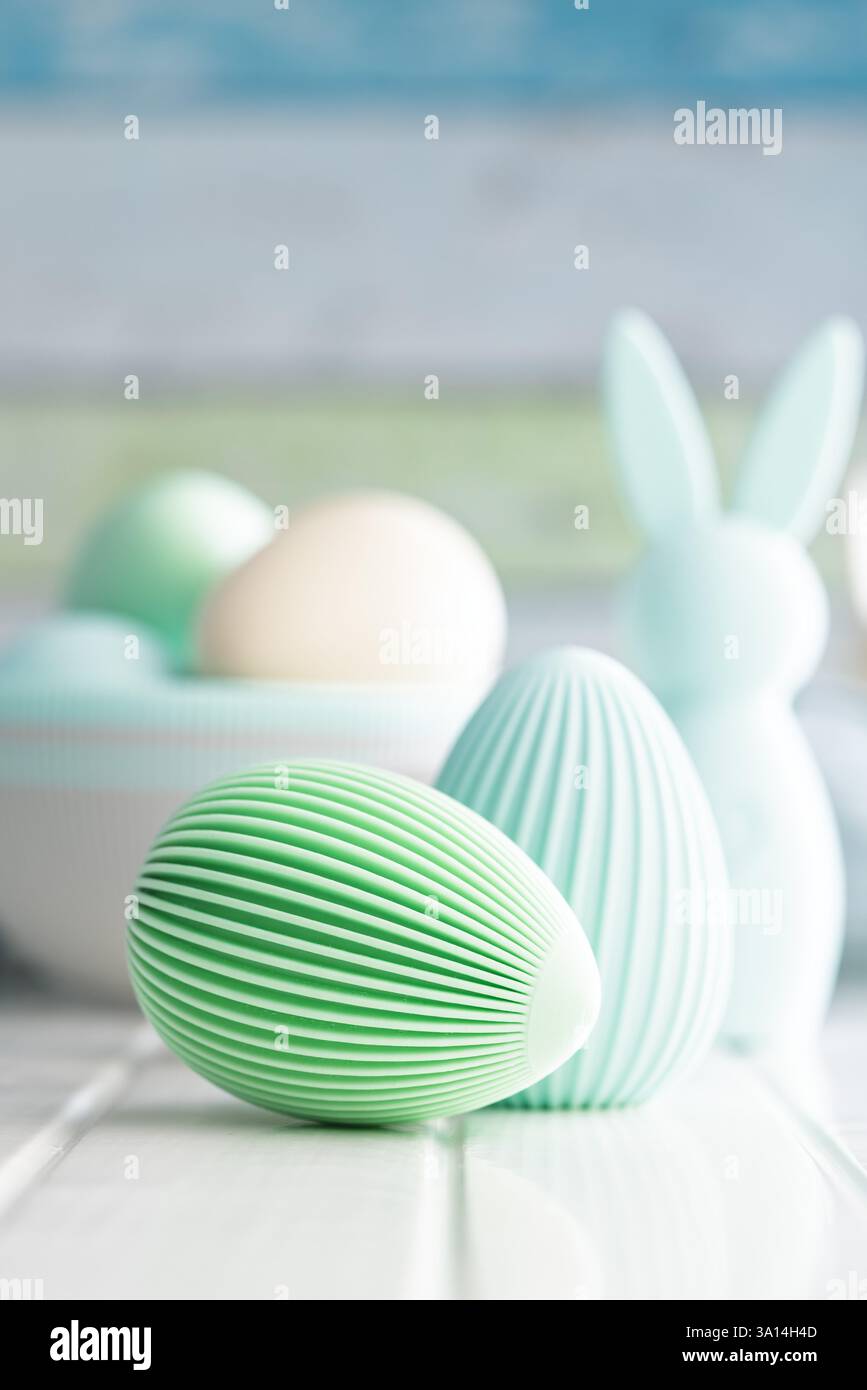 Easter decoration. Colorful eggs on a white table. Stock Photo