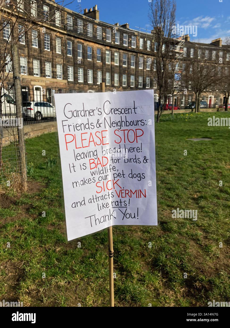 Neighbours request to desist leaving food for the birds as it makes pet dogs unwell and attracts vermin like rats, Gardners Crescent Edinburgh - Smartphone Captured Stock Image