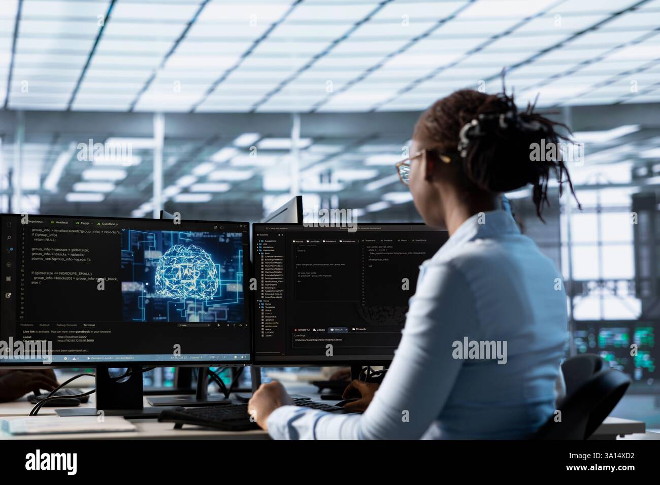 Investigating A Computer Engineer working at PC desk, doing checkup on AI server room providing ...