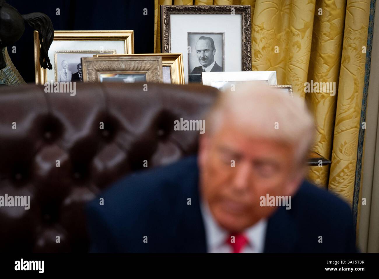 A photograph of US President Donald Trump's father, Fred Trump, on a table behind Trump's desk in the Oval Office of the White House in Washington, DC, US, on Thursday, March 6, 2025. Trump is signing orders to pause tariffs on USMCA trade from Canada and Mexico until April 2. Photo by Al Drago/Pool/ABACAPRESS.COM Credit: Abaca Press/Alamy Live News Stock Photo