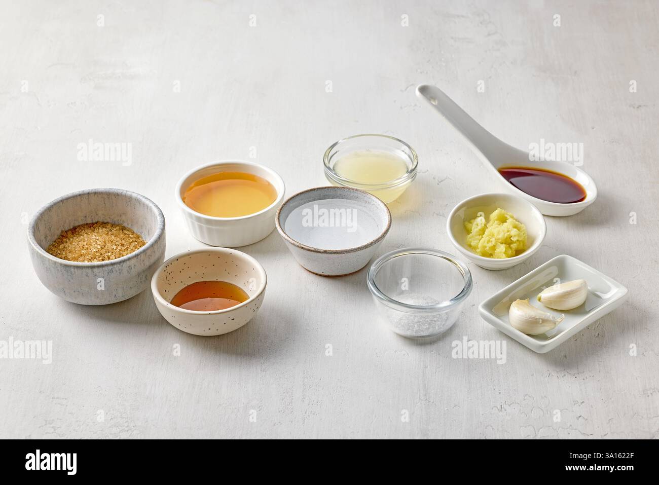 various salad dressing ingredients on white table background Stock Photo