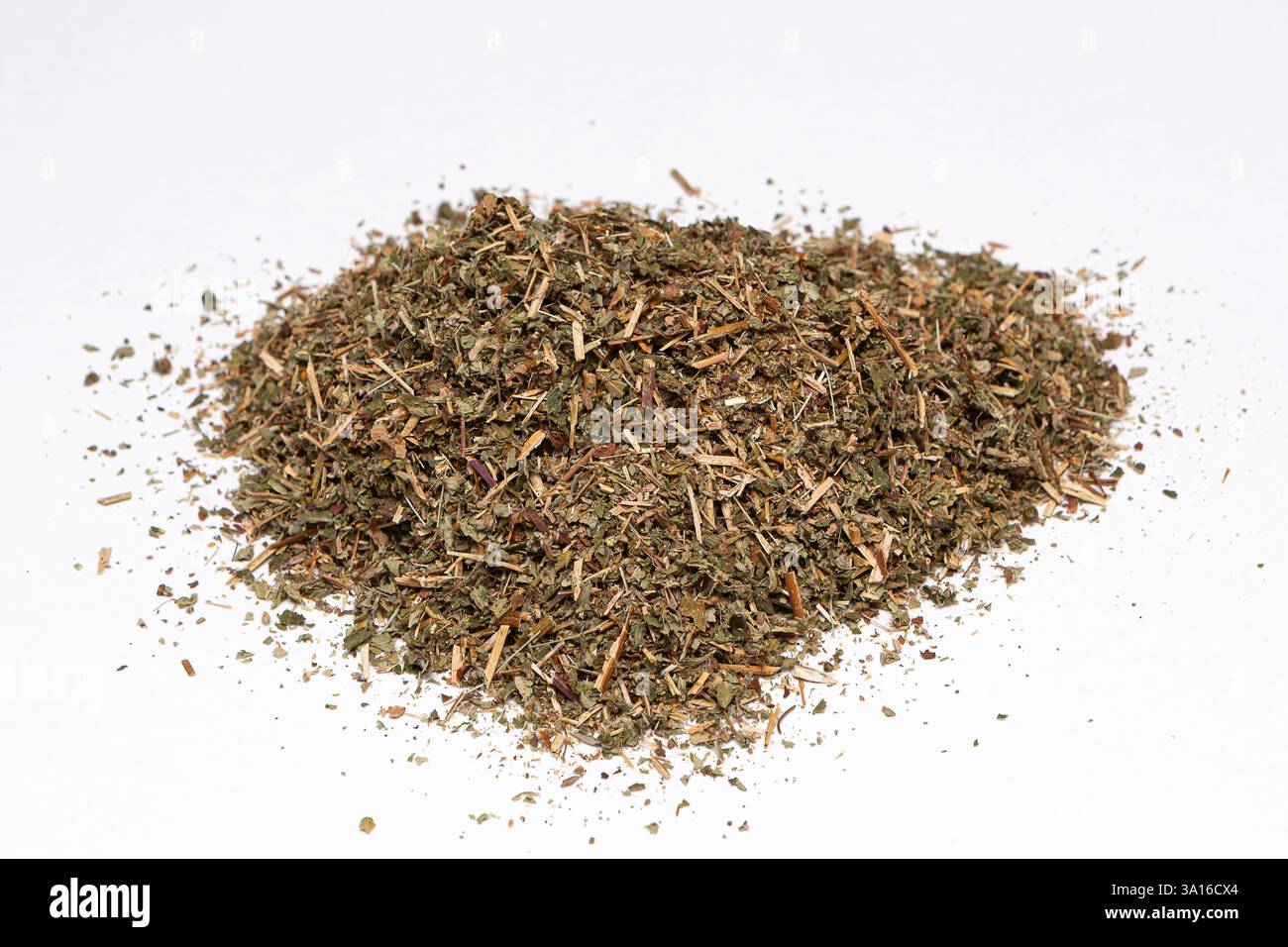 Dried raspberry leaf forming a small pile, ideal for herbal tea infusions and alternative medicine remedies Stock Photo