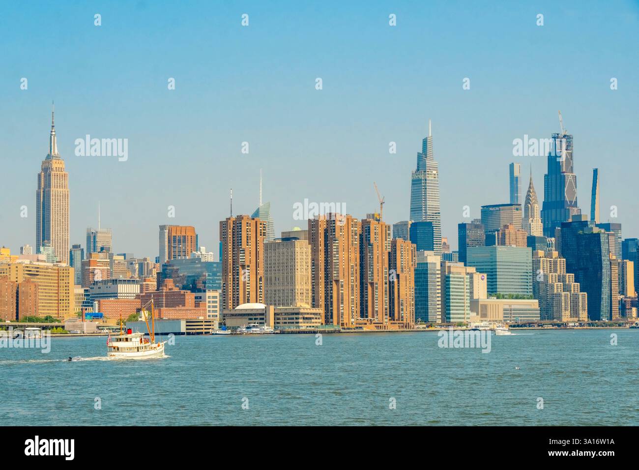 United States, New York State, New York City, sailing along the East River with the New York Ferry, Midtown Manhattan and Empire State Building Stock Photo