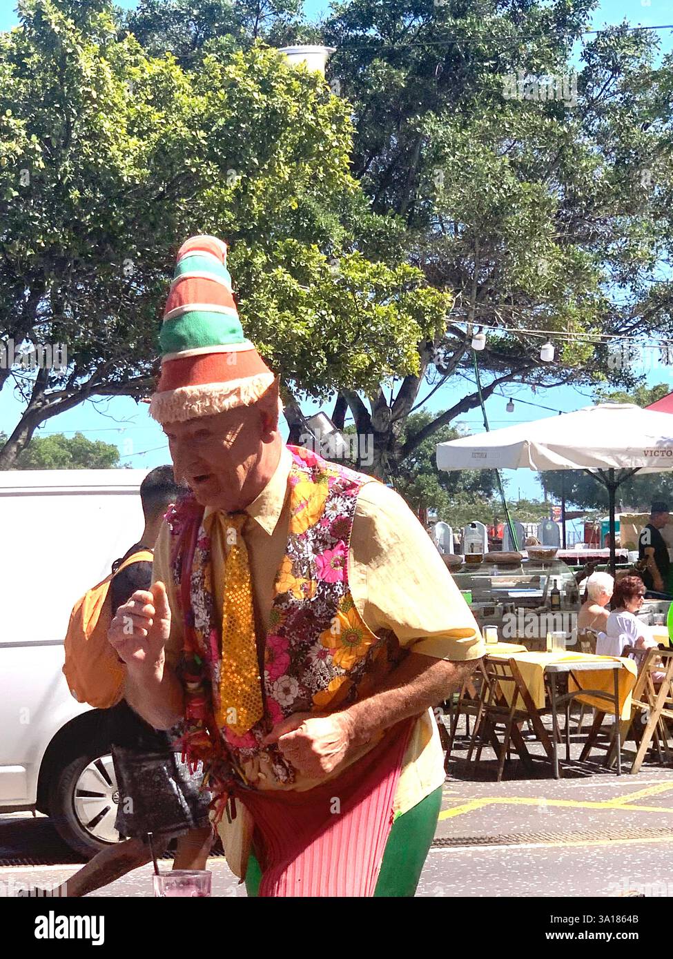 Carnival in Tenerife Canary Islands Spain man fancy dress heart shaped shapes balloons balloon hot sunny on holiday place beach  town local art work - Smartphone Captured Stock Image