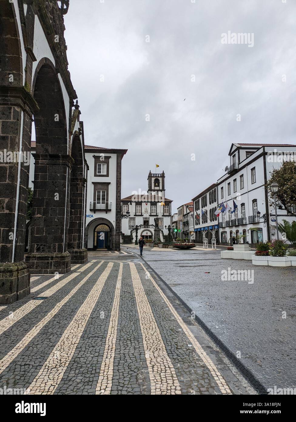 The City Gates of Ponta Delgada and São Sebastião Church in São Miguel, Azores, showcase historic basalt architecture, rich heritage, and island charm - Smartphone Captured Stock Image