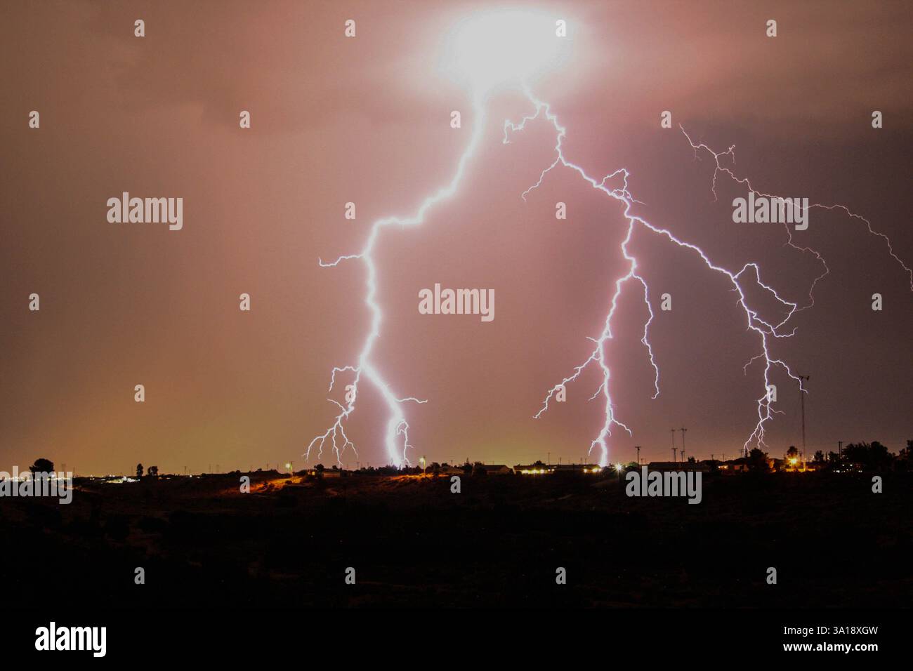 Lightning strike during a storm in a desert town Stock Photo - Alamy