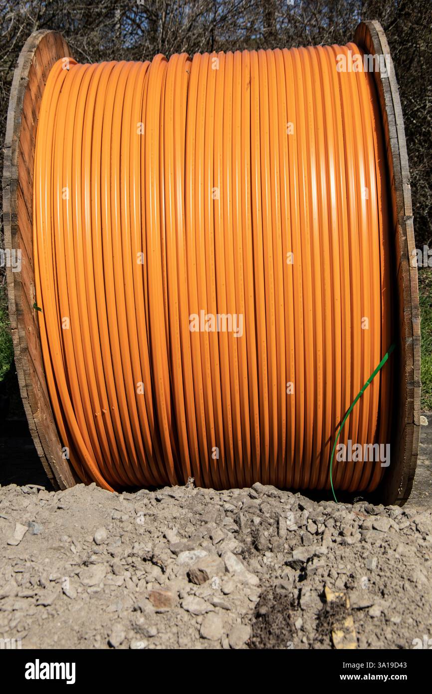 Fiber optic cable on a drum on the construction site Stock Photo