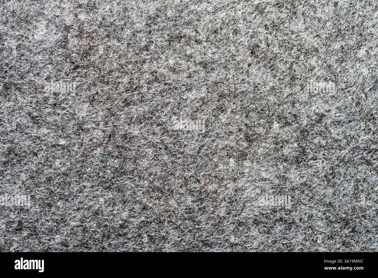gray synthetic fiber felt background texture macro image Stock Photo