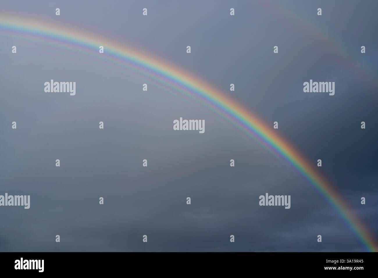 Low angle view to sky with rainbow Stock Photo