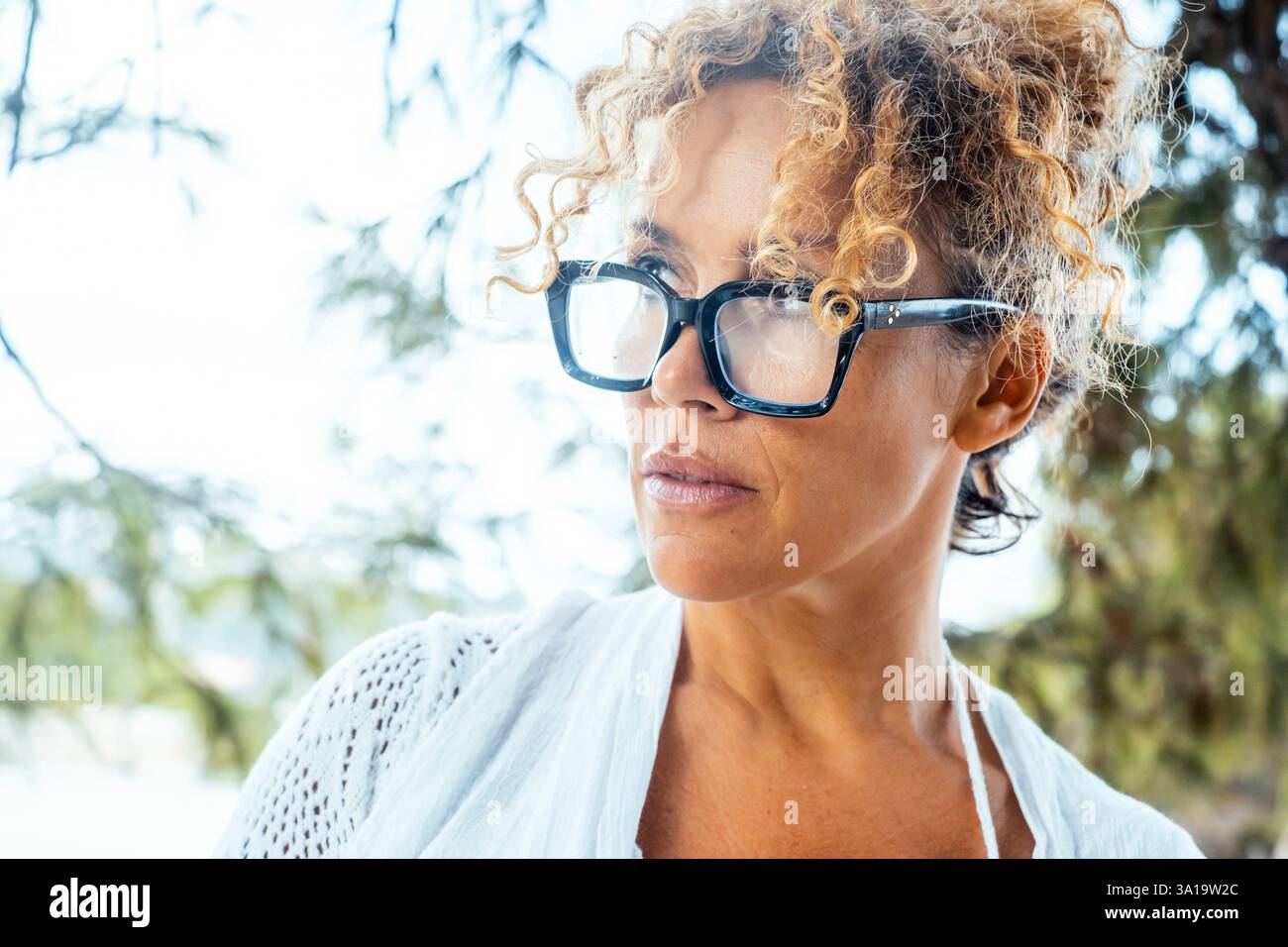 Woman curly hair in glasses hi-res stock photography and images - Alamy