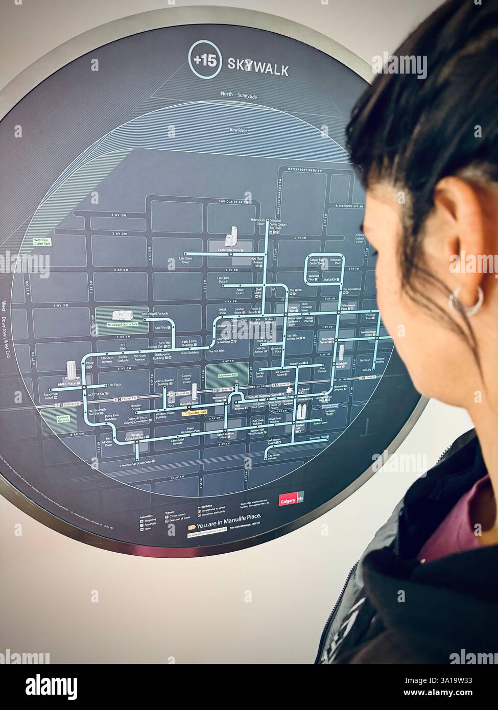 Unidentified person looking at the bridge skywalk system in Alberta, Canada - Smartphone Captured Stock Image