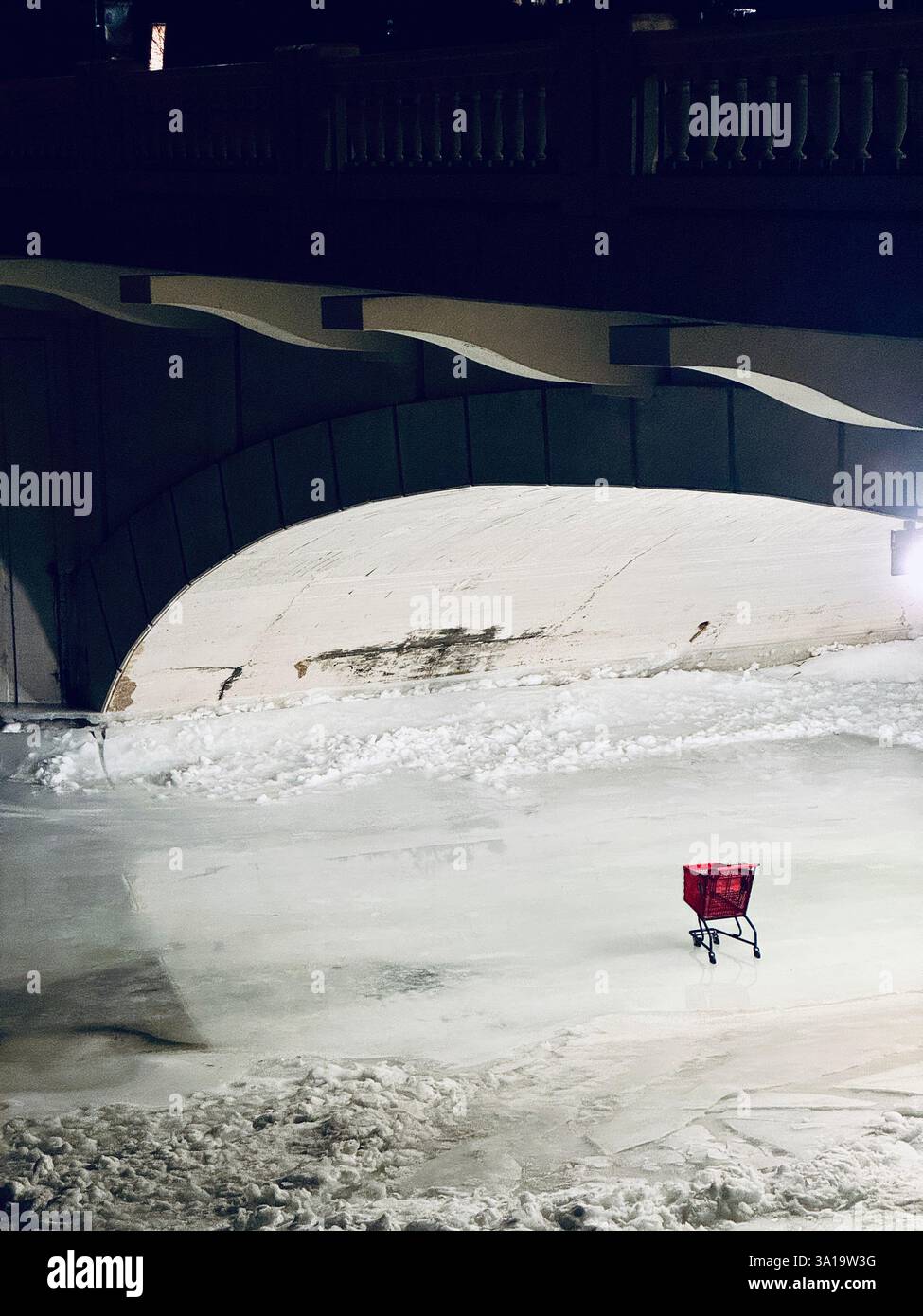 Shopping cart abandone in the middle of a frozen lake in Calgary, Canada - Smartphone Captured Stock Image