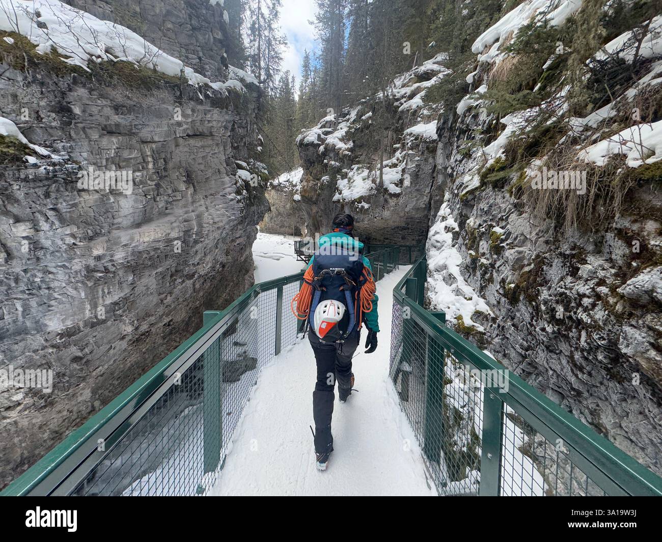Unidentified person walking down the Johnston Canyon in Banff, Alberta - Smartphone Captured Stock Image