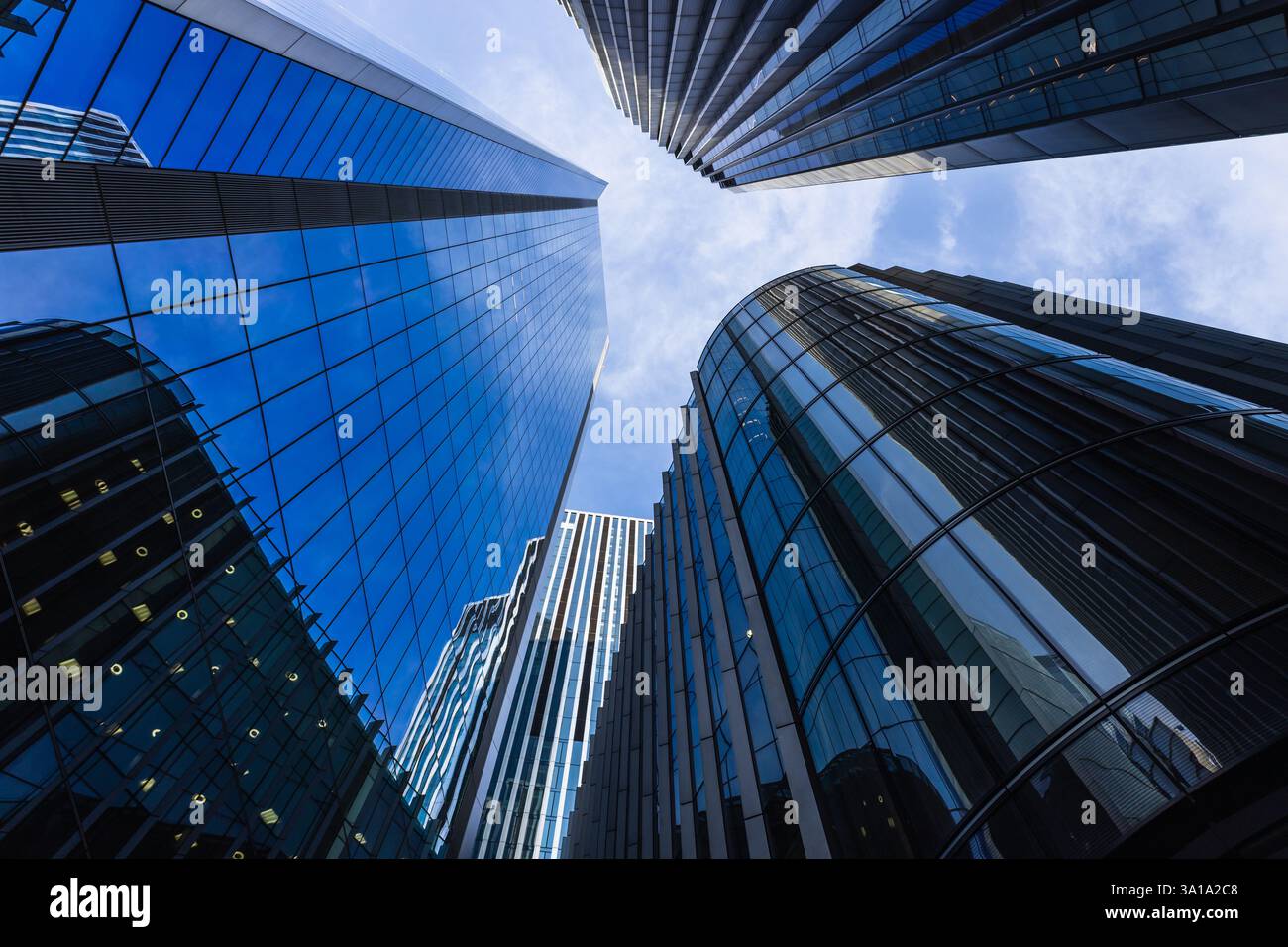 Futuristic cityscape with towering skyscrapers and reflective glass ...