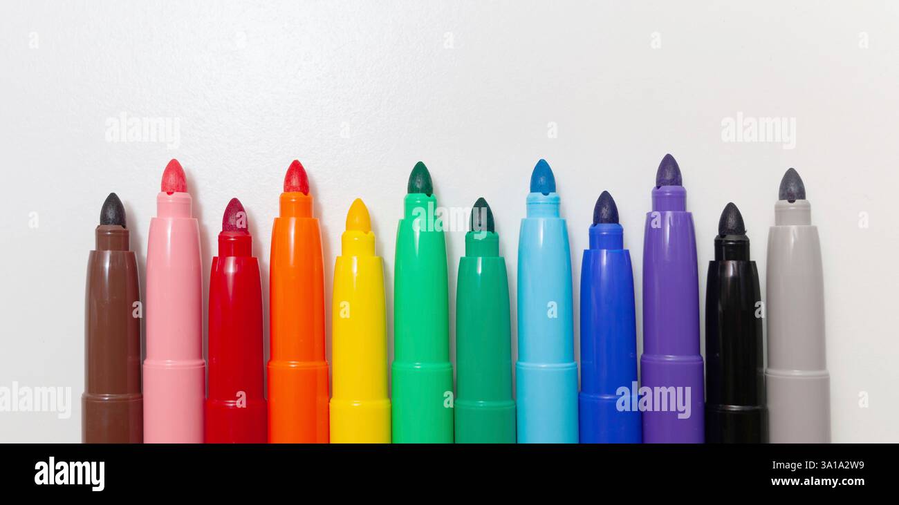 Multi-colored felt-tip pens, markers on a white isolated background. Stock Photo
