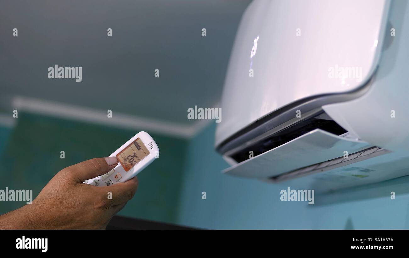 Air conditioning ignition with remote control. Stock Photo