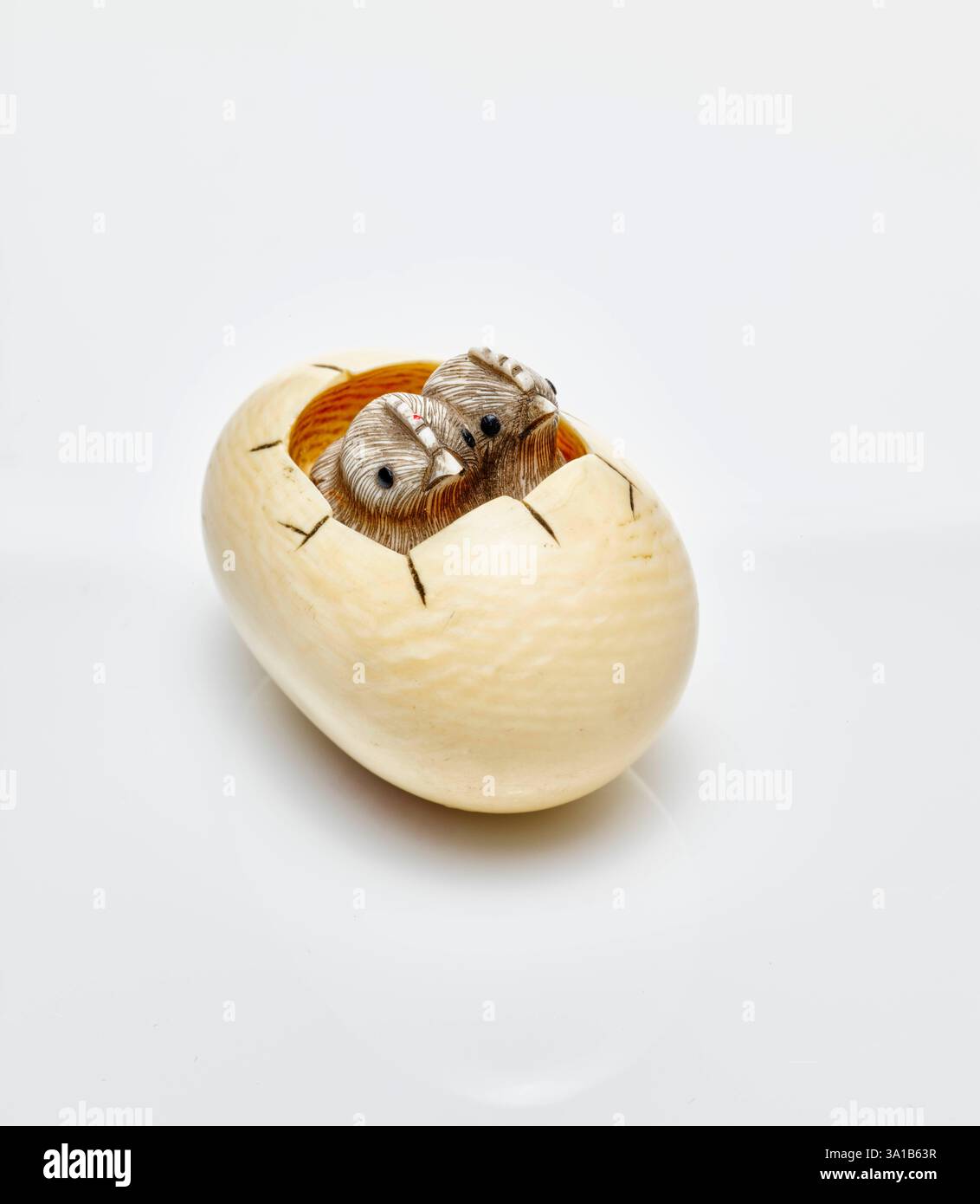 Netsuke (two chicks hatching from egg), 19th century. Stock Photo