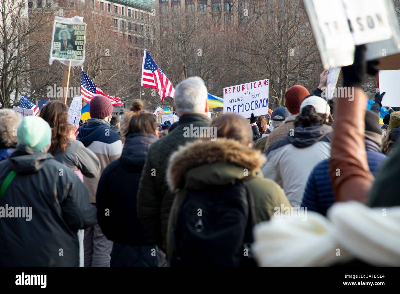 People protesting Donald Trump and Elon Musk at the Boston Commons in ...