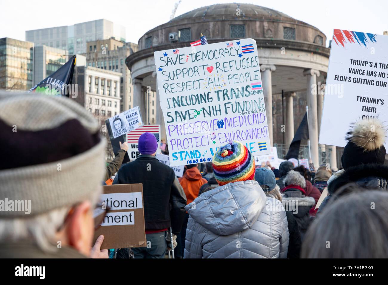 People protesting Donald Trump and Elon Musk at the Boston Commons in ...