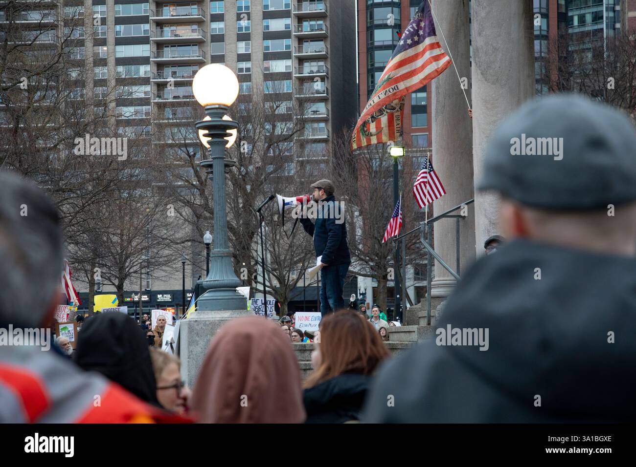 People protesting Donald Trump and Elon Musk at the Boston Commons in ...