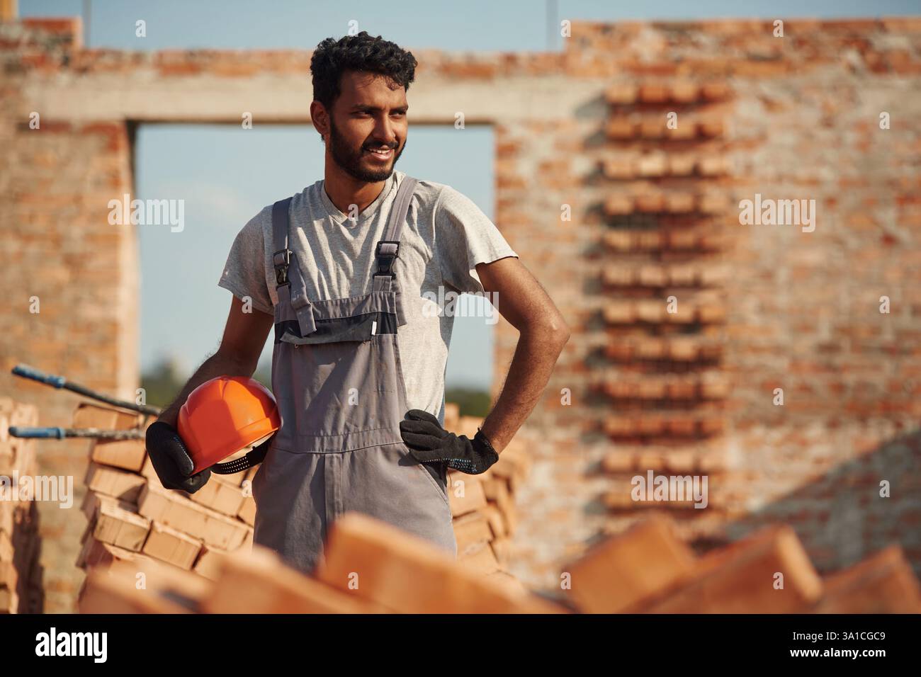 Handsome Indian man is on the construction site. Stock Photo